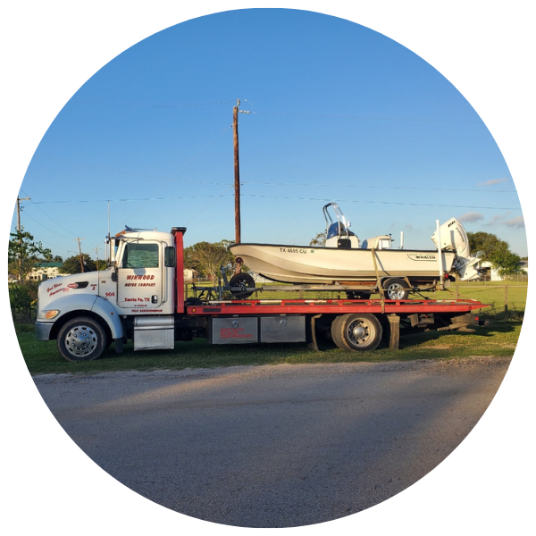 tow truck hauling a boat